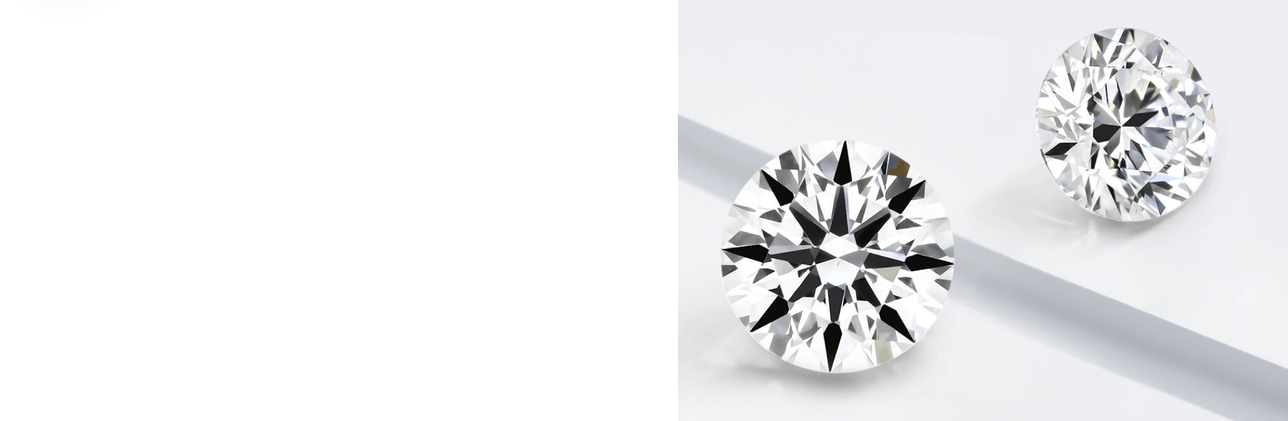 Two round-cut diamonds displayed on a reflective surface with a light shadow.