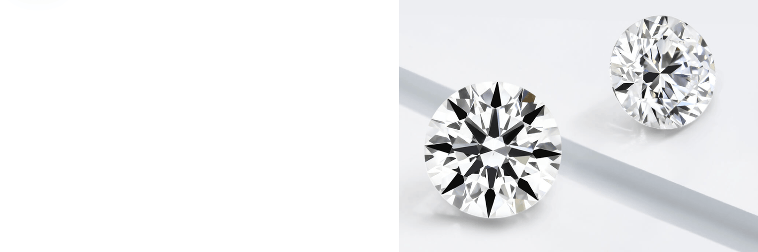 Two brilliant-cut diamonds placed on a white surface, showcasing their facets and reflections."